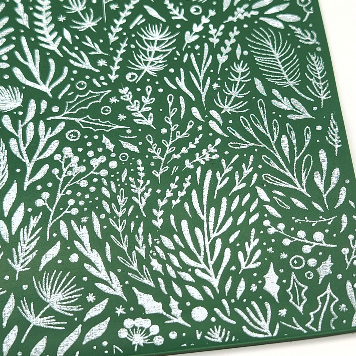 showing details of Winter Boughs and Berries design on actual sample on polymer clay slab