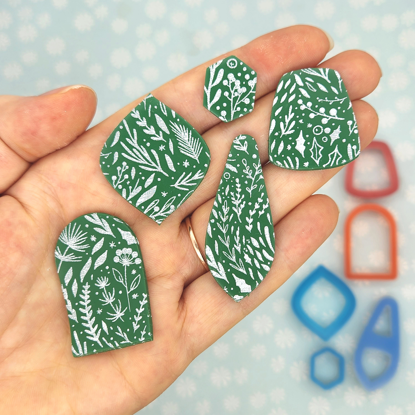 actual sample of Winter Boughs and Berries silk screen design on polymer clay shapes