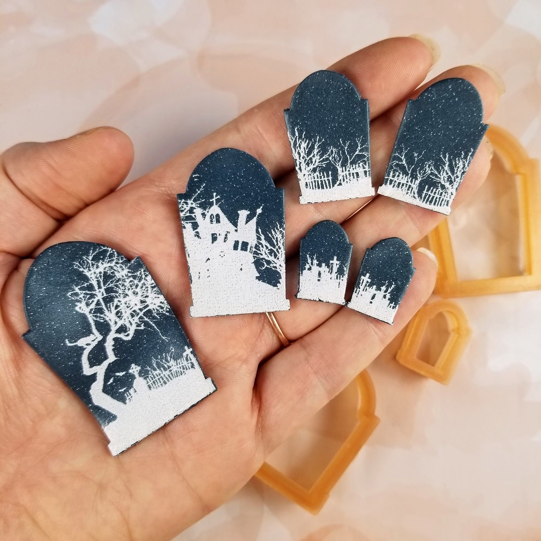 Tombstone polymer clay cutters used on clay that has the image from the Spooky Silhouette graveyard scene silk screen