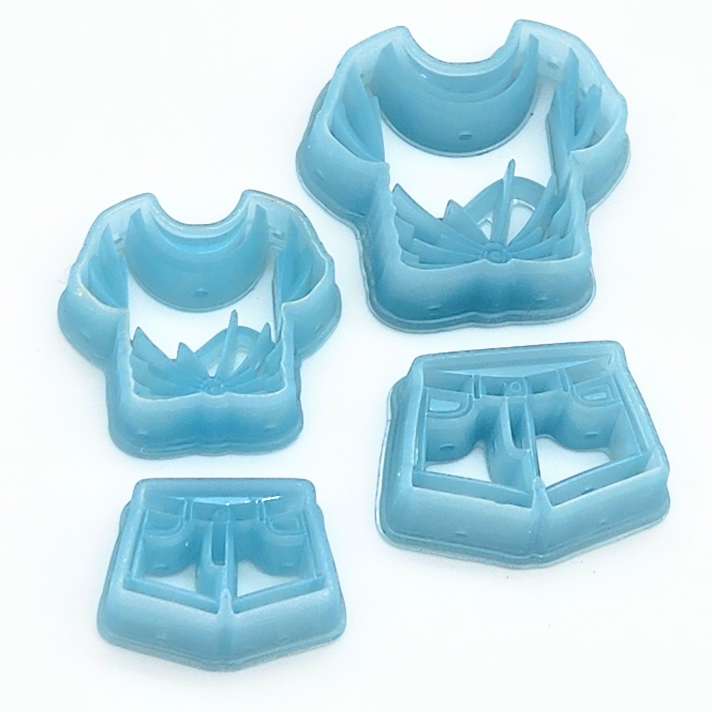 Polymer clay cutters shaped like a summer outfit: t-shirt and shorts.