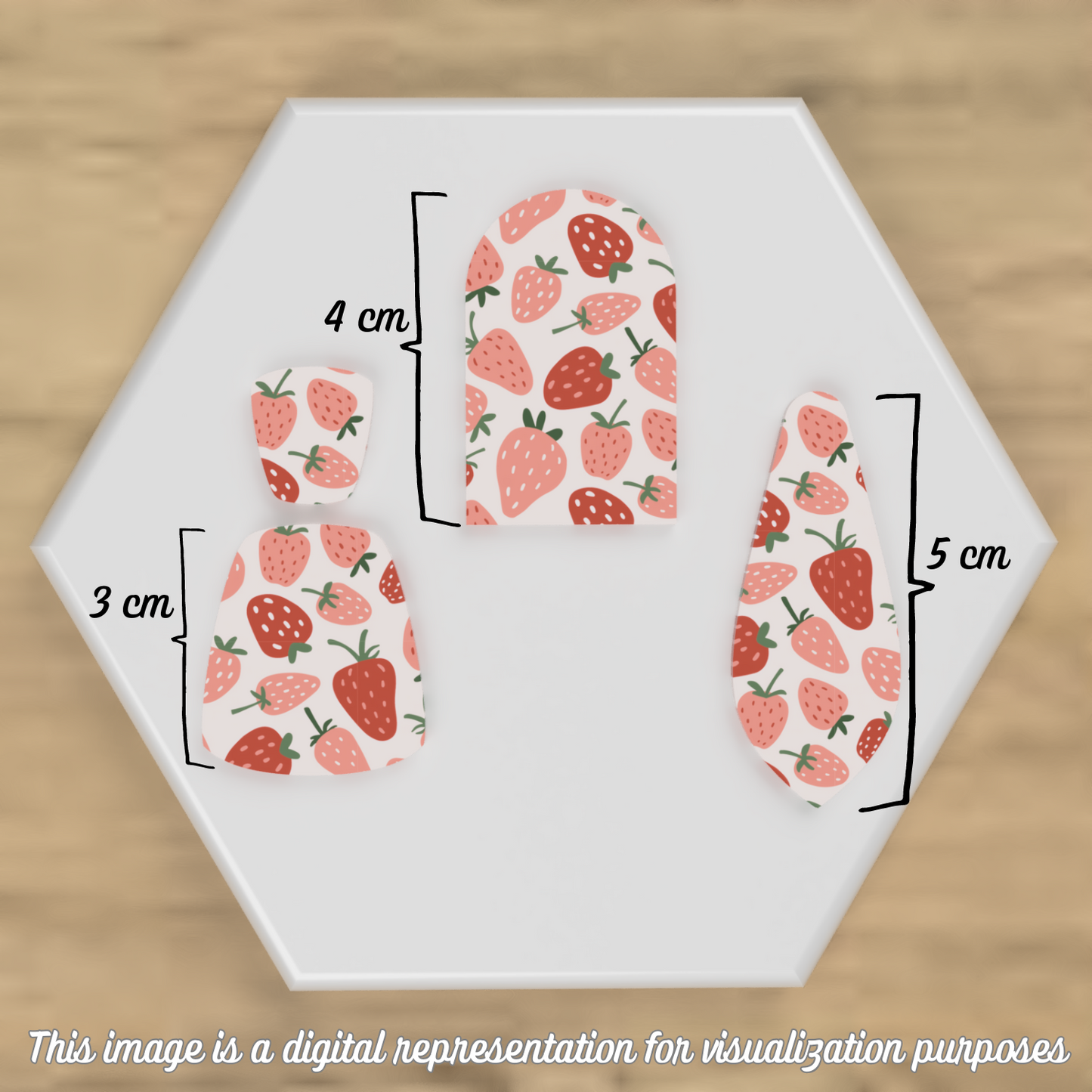 Example of cut-out pieces from the transfer sheet, showing various shapes and sizes to use on polymer clay.