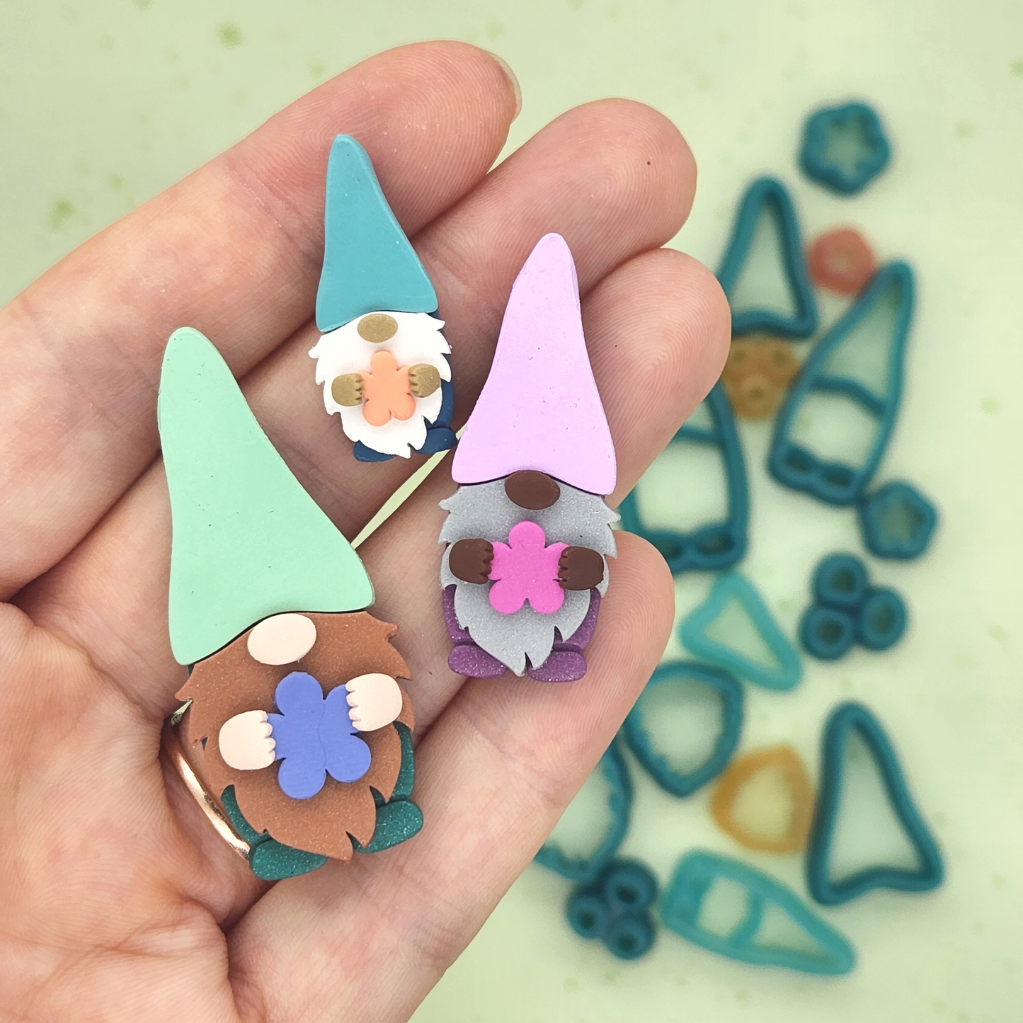 Polymer clay Garden Gnome sample finish product, in three sizes.
