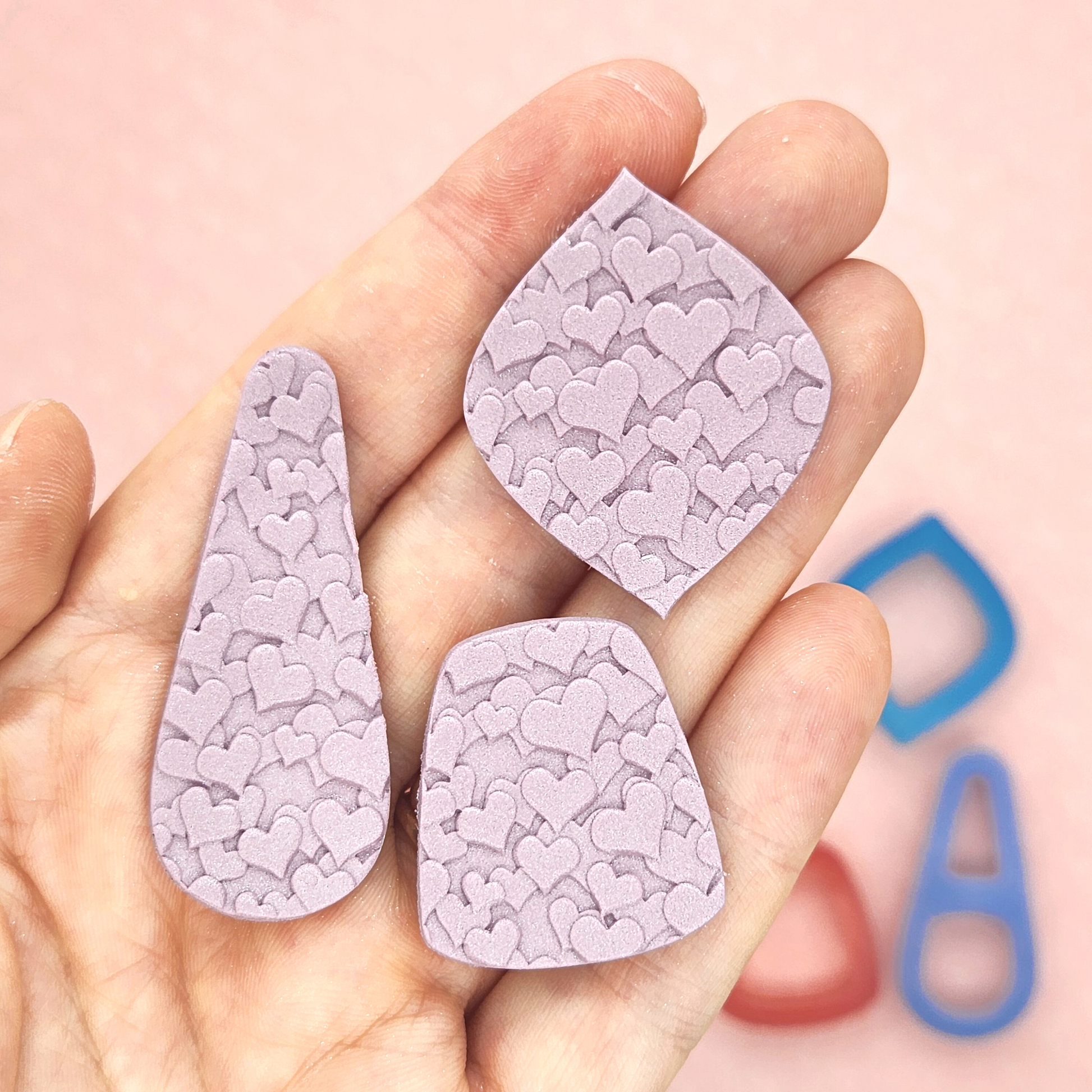 Scattered hearts pattern on polymer clay shapes, Rounded teardrop cutter, Miya outline cutter, Brandy outline cutter