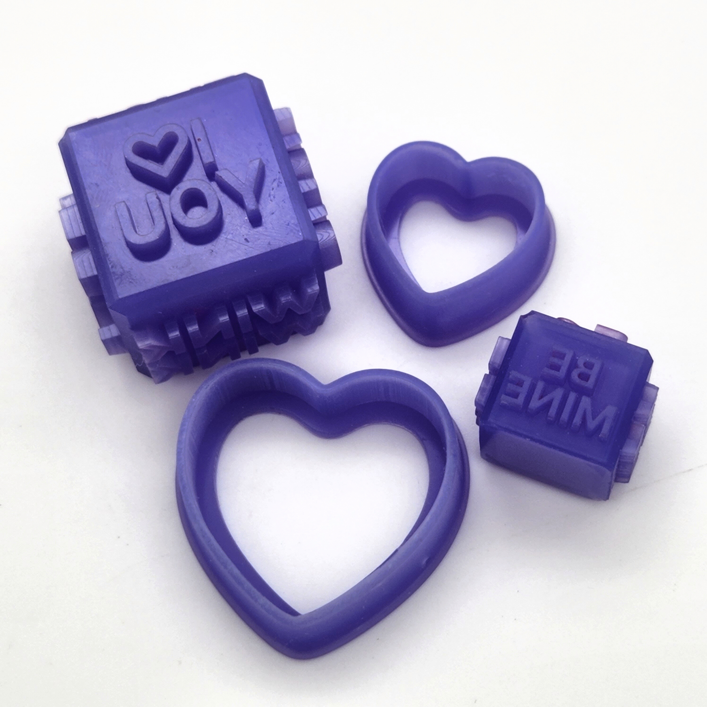 3D printed sweethearts debossing cube and clay cutter made of resin, zoomed in close up angle to show sharp edge details