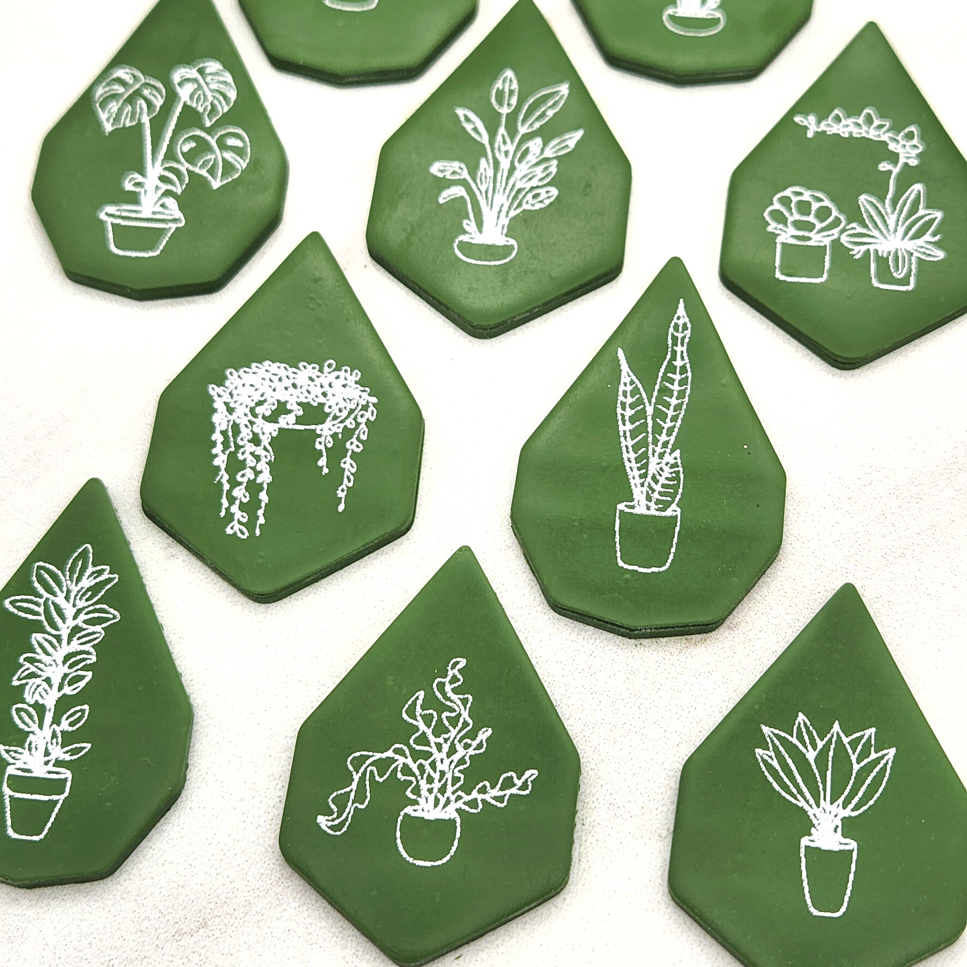 Zoomed in angle to show details of sample output of Potted Plants Silkscreen on Polymer Clay, shaped using Gemma Cutter.