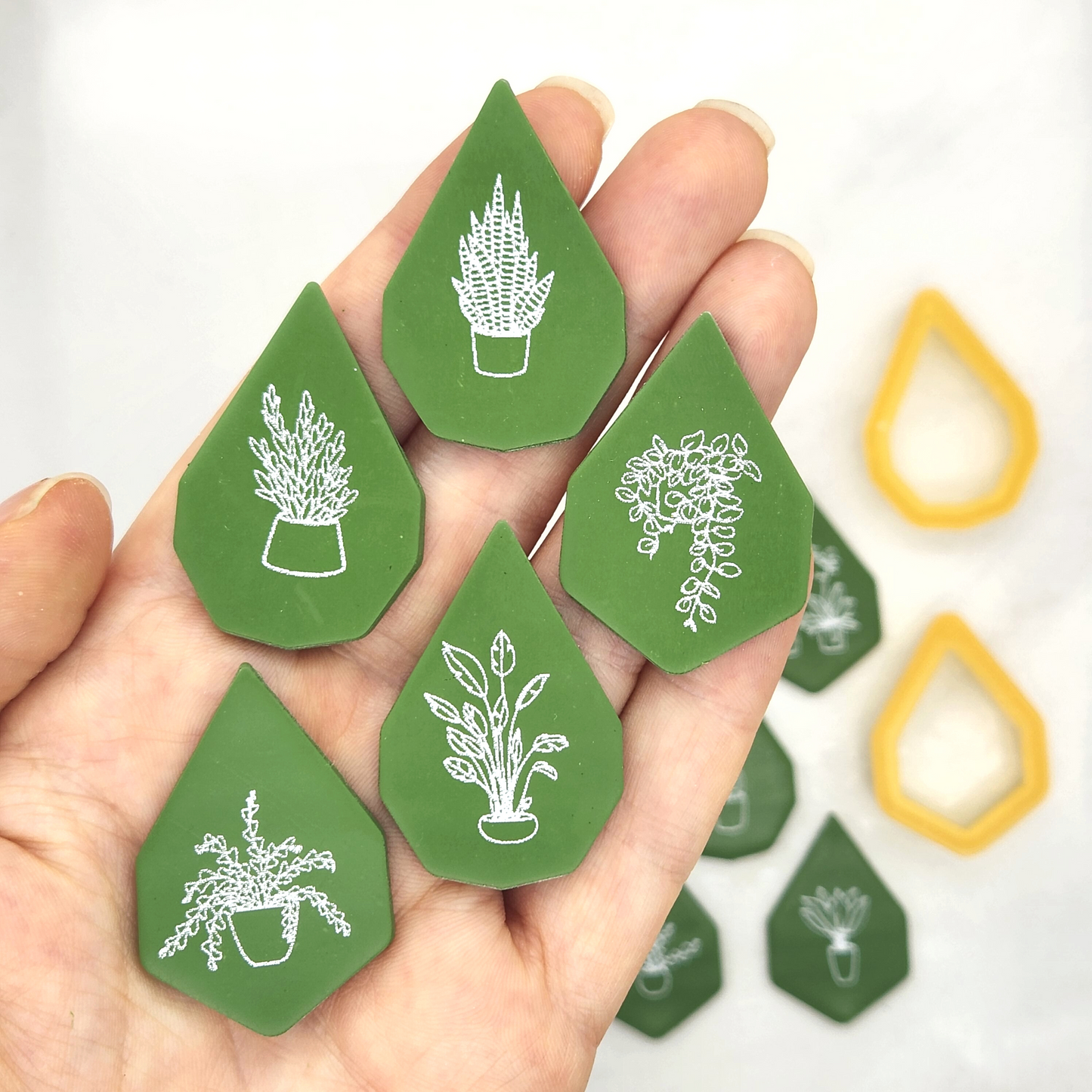 Sample output of the Potted Plants Silk screen on polymer clay. Gemma polymer clay cutter was used for the shape.