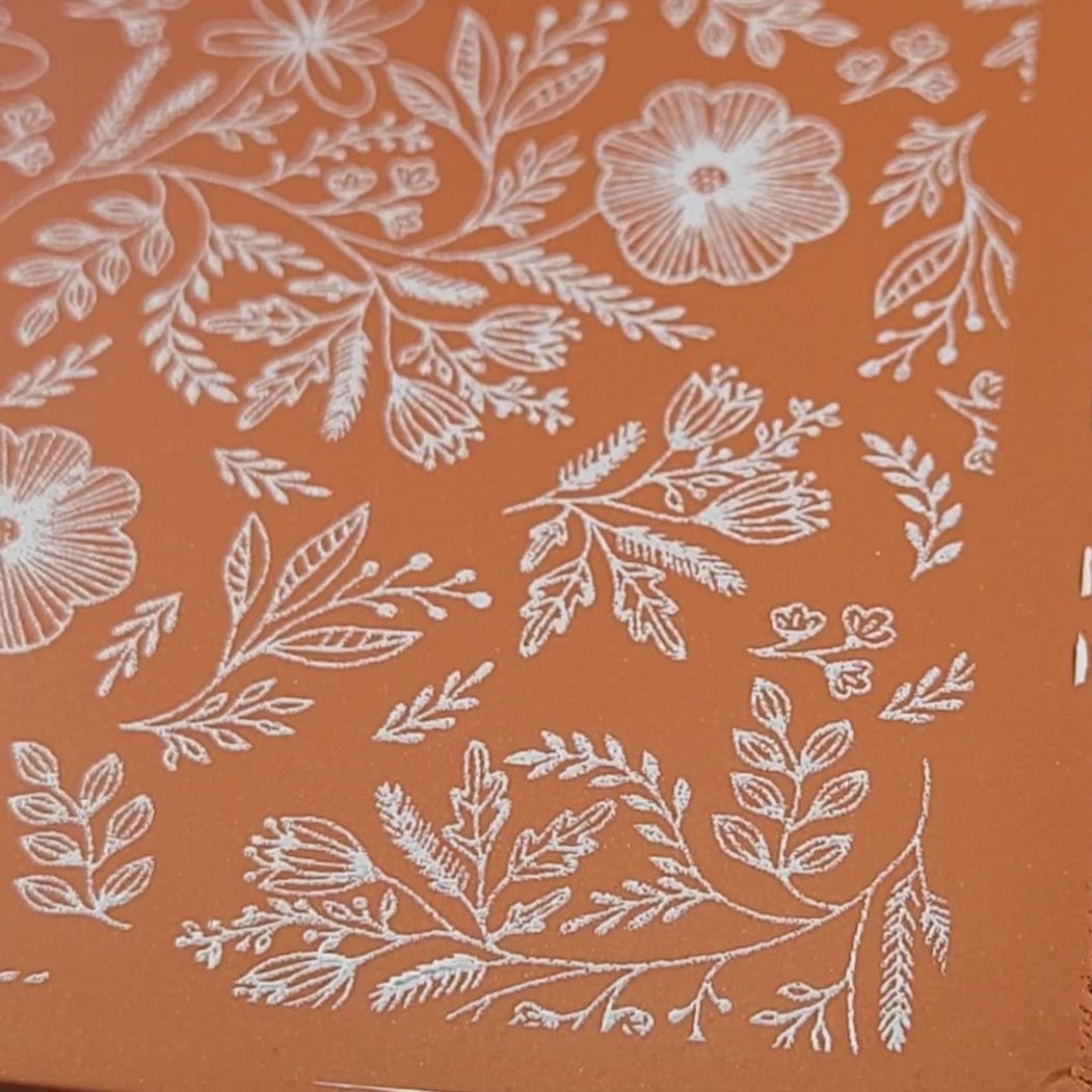 Bohemian Floral Botanical design pattern silk screen stencils clay painting. close up zoomed in details.