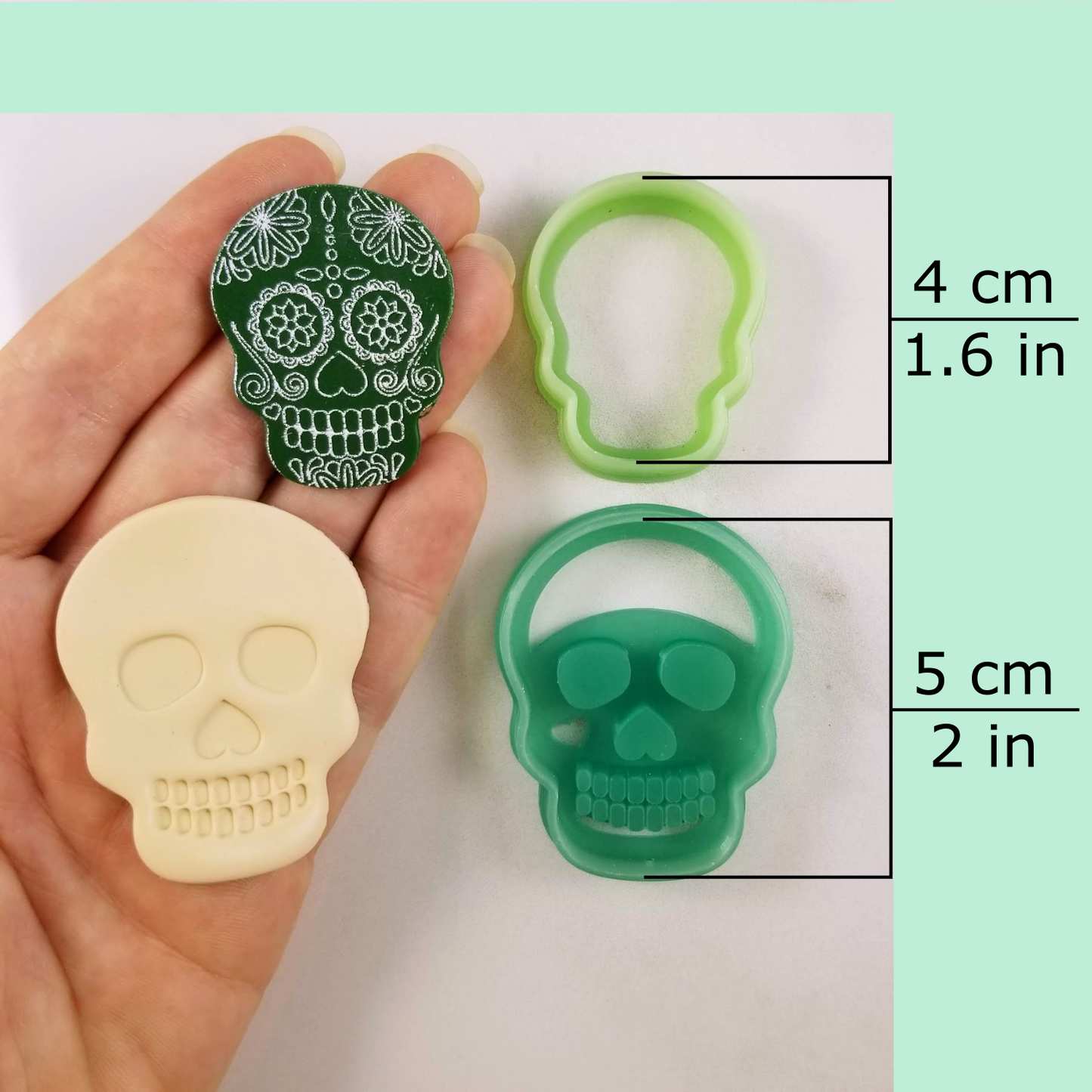 Debossing/embossing and outline skull polymer clay cutters dimensions: large, medium, dangle, statement sizes. 