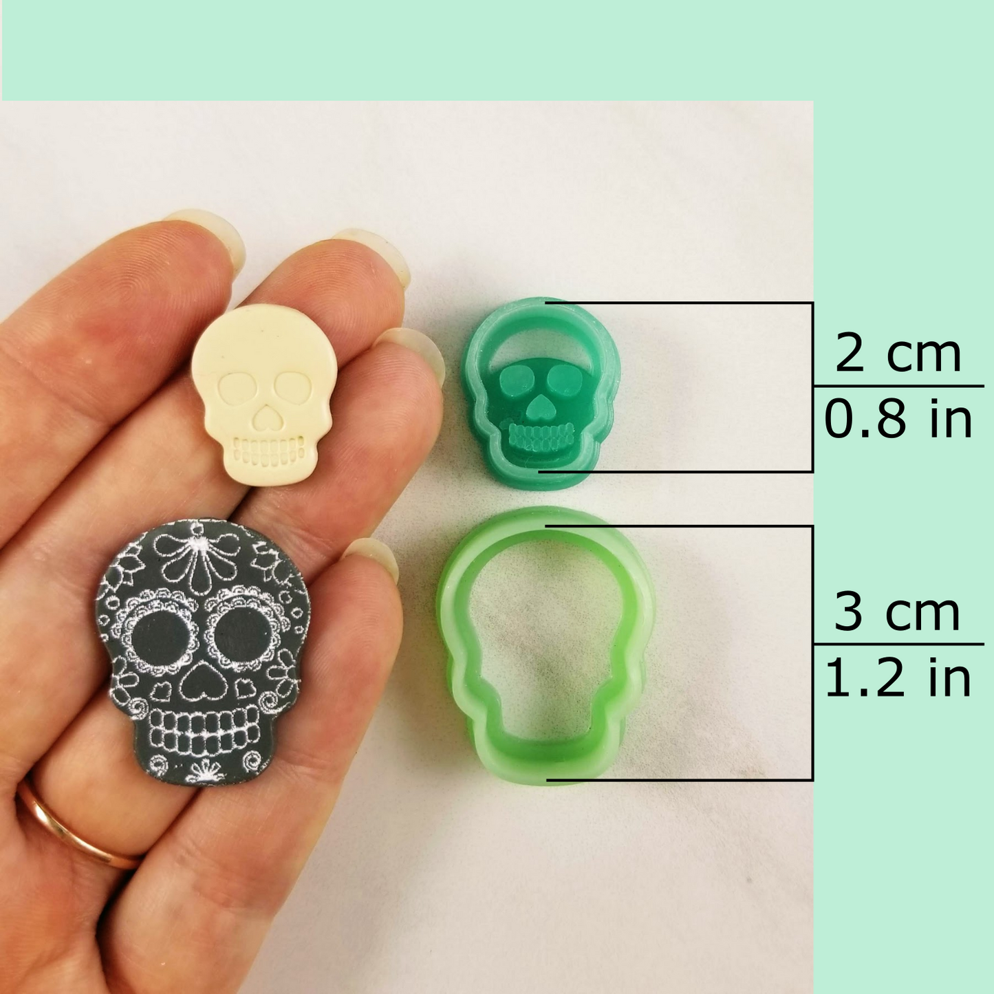 Debossing/embossing and outline skull polymer clay cutters dimensions: small, dangle, stud sizes.