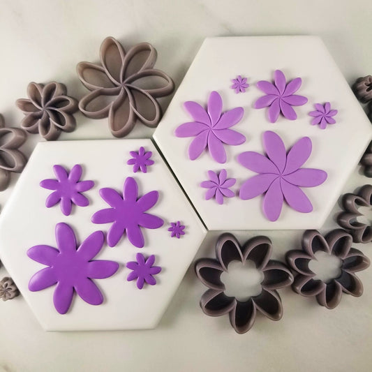 Tiare flower polymer clay cutter comes in two styles, outline and debossing cutters. In photo show comparison of the two styles with sample polymer clay finish product